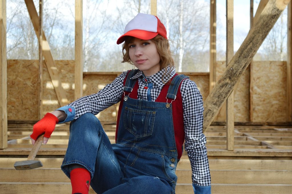 a hammer, tools, young woman